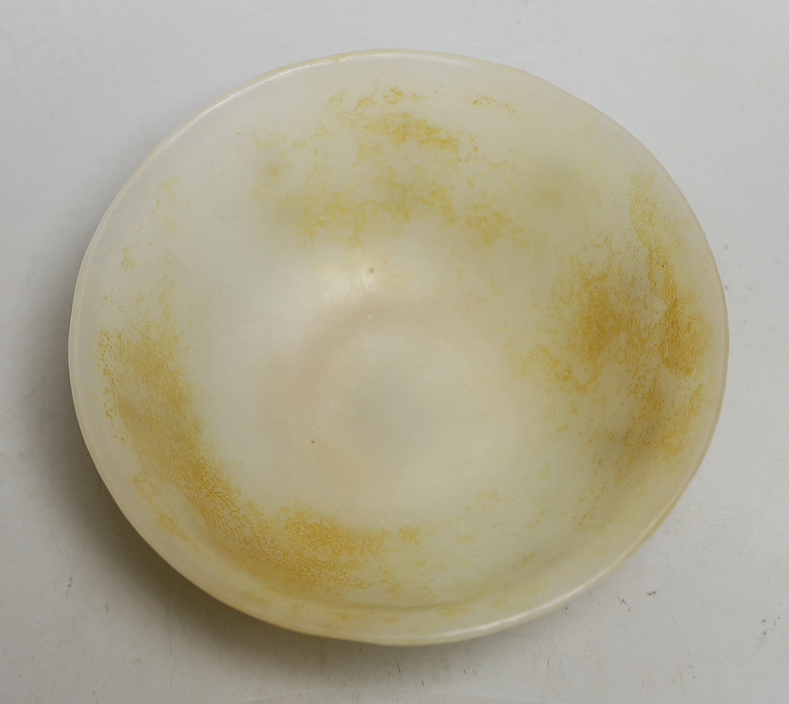 A Chinese carved glass bowl, 15cm diameter